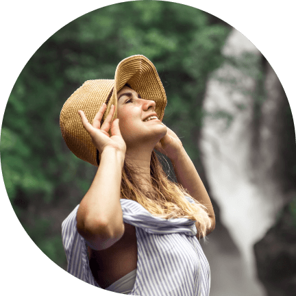 girl-hat-looks-waterfall-happy-young-woman-traveling